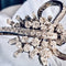 Broche Broche Art déco en or gris et platine, diamants 58 Facettes