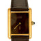 Montre Cartier Tank Must - Montre en argent plaqué or, cadran laqué marron « Bois » 58 Facettes