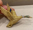 Broche Hermès - Broche canard en vol en or jaune et pierres précieuses 58 Facettes A_314_D