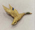 Broche Hermès - Broche canard en vol en or jaune et pierres précieuses 58 Facettes A_314_D
