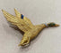 Broche Hermès - Broche canard en vol en or jaune et pierres précieuses 58 Facettes A_314_D
