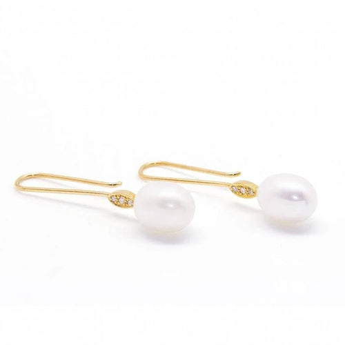 Boucles d'oreilles Boucles d'oreilles perles ovales et diamants en or jaune 18 carats 58 Facettes D360904FV