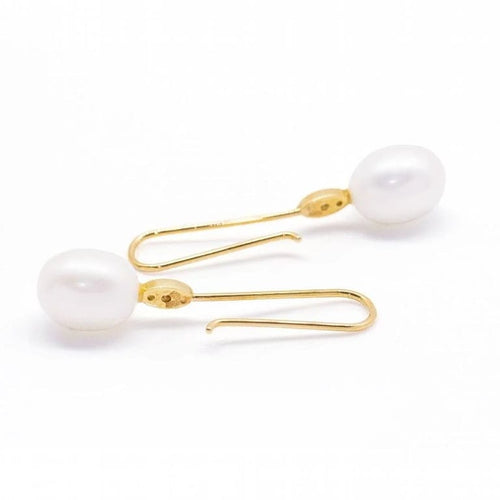 Boucles d'oreilles Boucles d'oreilles perles ovales et diamants en or jaune 18 carats 58 Facettes D360904FV