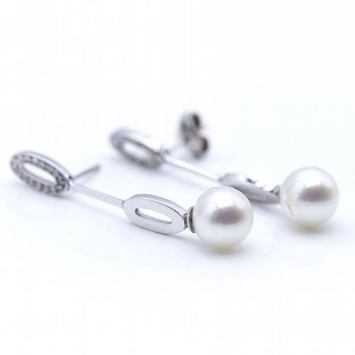 Boucles d'oreilles Boucles d'oreilles longues en or blanc, diamants et perles 58 Facettes N102863LF