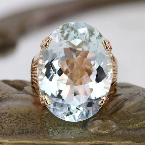 Bague 52 Bague vintage en or rose 18 carats et aigue-marine 58 Facettes 25-130