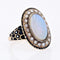Bague 48 Bague ancienne en or jaune 18 carats, opale, perles fines et émail 58 Facettes 22-493