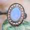 Bague 48 Bague ancienne en or jaune 18 carats, opale, perles fines et émail 58 Facettes 22-493