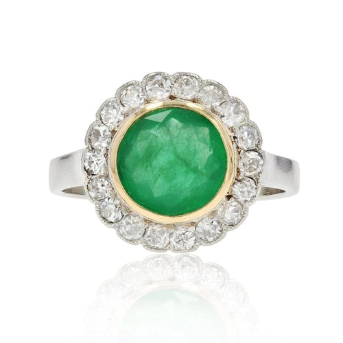 Bague 50 Bague ancienne ronde en platine et or jaune 18 carats, émeraude et diamants 58 Facettes 22-426