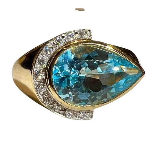 Bague 60 Bague en or jaune 18 carats avec topaze bleue poire et diamants 58 Facettes 7861 A