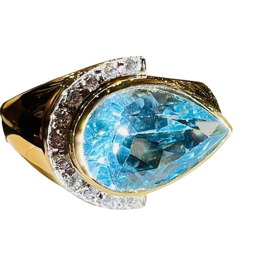 Bague 60 Bague en or jaune 18 carats avec topaze bleue poire et diamants 58 Facettes 7861 A