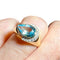 Bague 60 Bague en or jaune 18 carats avec topaze bleue poire et diamants 58 Facettes 7861 A