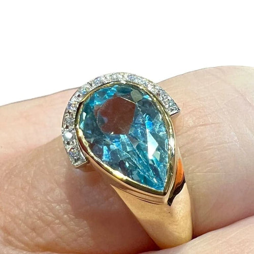 Bague 60 Bague en or jaune 18 carats avec topaze bleue poire et diamants 58 Facettes 7861 A