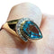 Bague 60 Bague en or jaune 18 carats avec topaze bleue poire et diamants 58 Facettes 7861 A