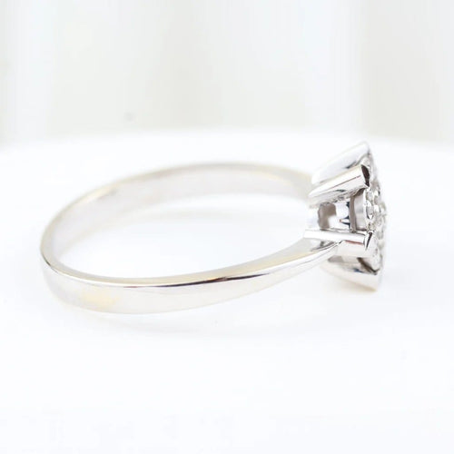 Bague 57 Bague rosette en or blanc 18 carats et diamants taille brillant 0,28 ct 58 Facettes 159/24K