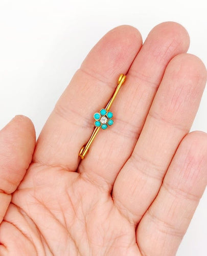 Broche Broche épingle à nourrice marguerite en or 18k, diamant et turquoises 58 Facettes A06686