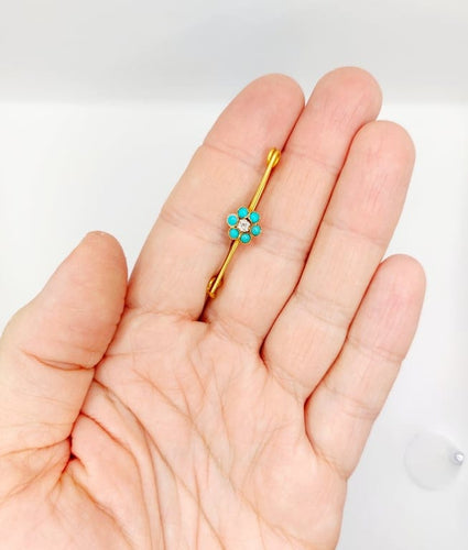 Broche Broche épingle à nourrice marguerite en or 18k, diamant et turquoises 58 Facettes A06686