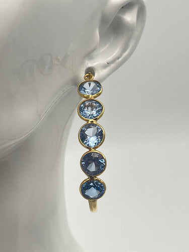 Boucles d'oreilles Créoles - Boucles d'oreilles en or jaune 18K et topazes bleues 58 Facettes 149064377