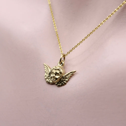 Pendentif Pendentif ou charm chérubin ailé en or 14K 58 Facettes