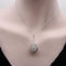 Collier Collier pendentif goutte en or blanc 18K, diamants et cristal de roche 58 Facettes A10029