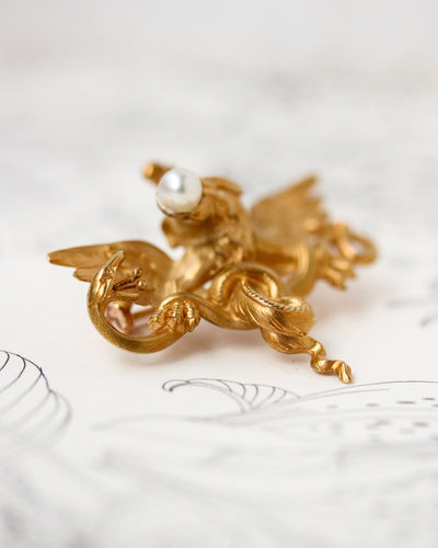 Pendentif Broche pendentif chimère en or jaune 750 et perle fine 58 Facettes A11949
