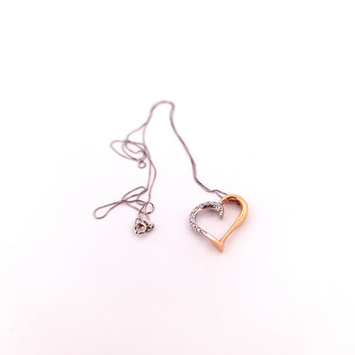 Collier Collier - Chaîne en or blanc avec pendentif cœur en or jaune et blanc diamants 58 Facettes