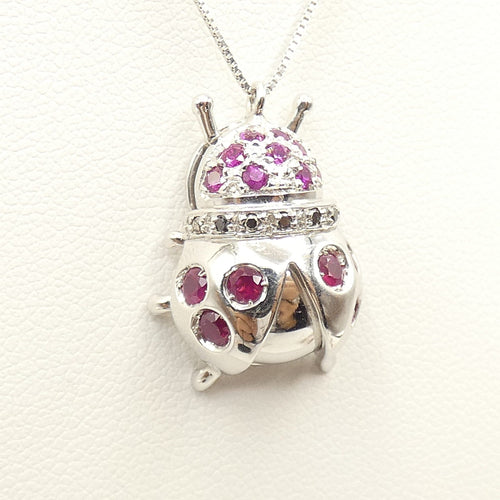 Collier Collier - Pendentif coccinelle en or blanc 18 kt, rubis et diamants noirs 58 Facettes