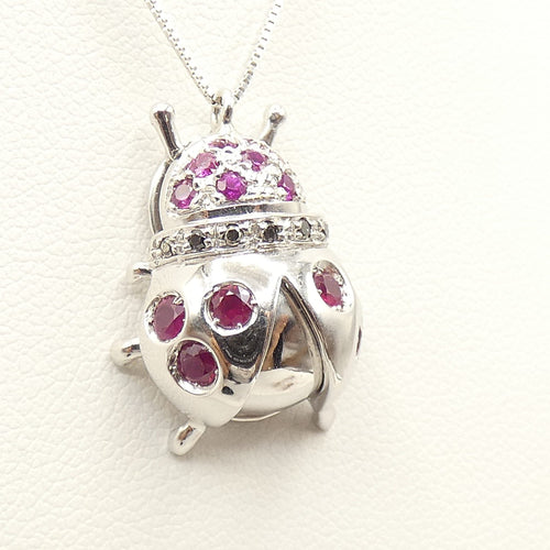 Collier Collier - Pendentif coccinelle en or blanc 18 kt, rubis et diamants noirs 58 Facettes