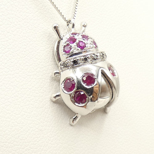 Collier Collier - Pendentif coccinelle en or blanc 18 kt, rubis et diamants noirs 58 Facettes