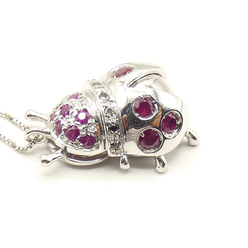 Collier Collier - Pendentif coccinelle en or blanc 18 kt, rubis et diamants noirs 58 Facettes