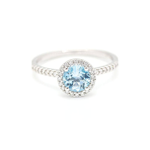 Bague Bague halo en or blanc 18 kt avec diamants et topaze bleue 58 Facettes UKD359674LF