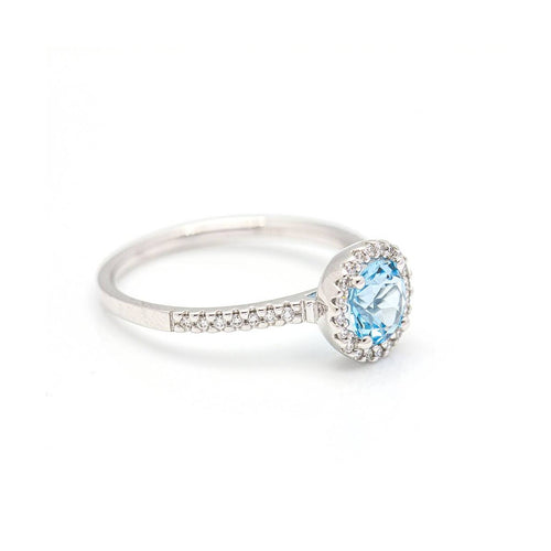 Bague Bague halo en or blanc 18 kt avec diamants et topaze bleue 58 Facettes UKD359674LF