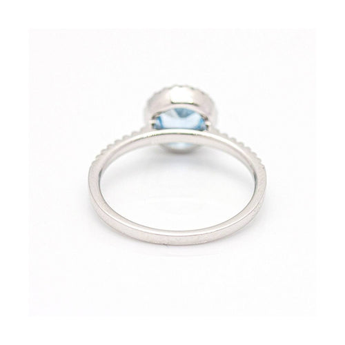 Bague Bague halo en or blanc 18 kt avec diamants et topaze bleue 58 Facettes UKD359674LF