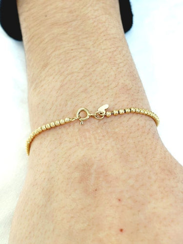 Bracelet Bracelet perlé en or jaune 18 carats 58 Facettes 1717142