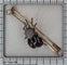 Broche Broche victorienne française en forme de barrette ornée d'un scarabée serti de grenats, de rubis et de diamants 58 Facettes 26050-0148