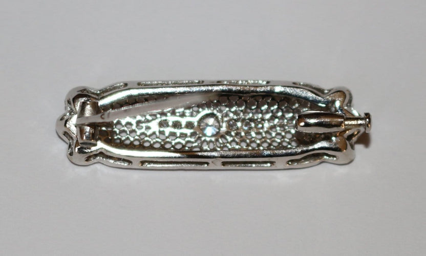 Broche Broche-barrette Art déco en or blanc 18 carats et diamants 58 Facettes 603