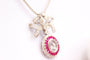 Collier Collier avec pendentif-broche nœud pavé de diamants et rubis 58 Facettes MT240099