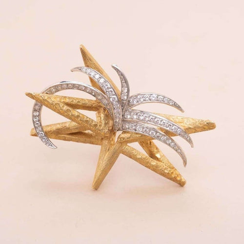 Broche Boucheron Starlight - Broche étoile en or jaune et platine diamants 58 Facettes 793350