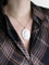 Pendentif Pendentif ovale or jaune camée coquillage Cupidon 58 Facettes 1224.5