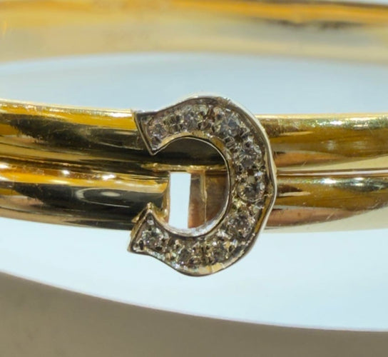Bracelet Cartier - Bracelet jonc double C en or jaune et blanc et diamants 58 Facettes cartier