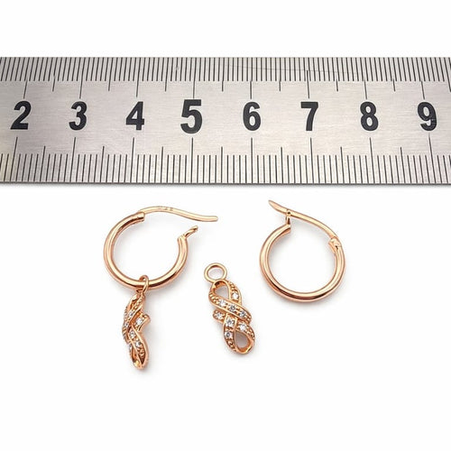 Boucles d'oreilles Boucles d’oreilles en or rose 18 carats serties de diamants 58 Facettes Boucles d’oreilles en or rose 18K serties de diamants