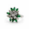 Bague 56 Bague fleur en or blanc 18 ct, diamants et émeraudes 58 Facettes 50258
