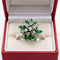 Bague 56 Bague fleur en or blanc 18 ct, diamants et émeraudes 58 Facettes 50258
