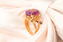 Bague 54 Bague motif corde en or jaune 750 sertie d’une améthyste 58 Facettes 250317