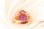 Bague 54 Bague motif corde en or jaune 750 sertie d’une améthyste 58 Facettes 250317