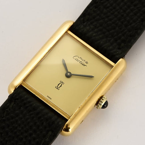 Montre Cartier Tank Must - Montre en argent plaqué or, cadran muet crème 58 Facettes A1163.