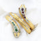 Bracelet Bracelet serpent Tubogas en or jaune serti de diamants, de rubis et d'émeraudes 58 Facettes 22478