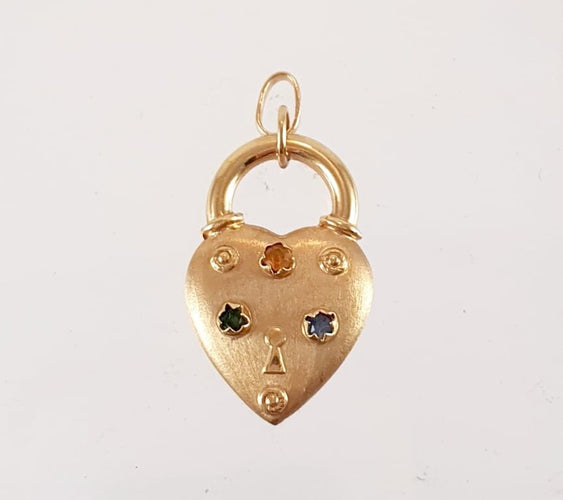 Pendentif Breloque cœur en or jaune 750 sertie de pierres fines 58 Facettes