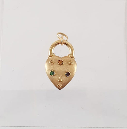 Pendentif Breloque cœur en or jaune 750 sertie de pierres fines 58 Facettes