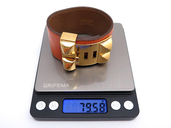 Bracelet vintage bracelet HERMES collier de chien medor cdc en cuir swift orange 58 Facettes 273457