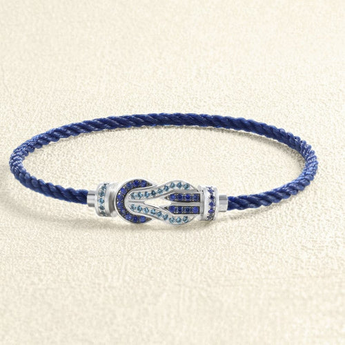 Bracelet Bracelet sur câble FRED Chance Infini MM Or blanc, saphirs, topazes bleues 58 Facettes OC-66000249